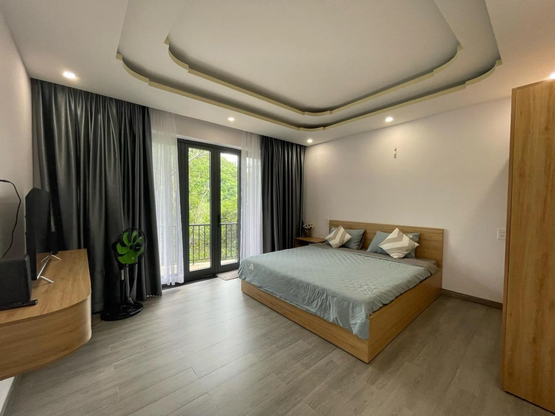Sunlit bedroom facing the garden.